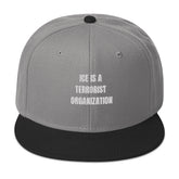 Snapback Hat with bold text "ICE IS A TERRORIST ORGANIZATION" in white on navy background.