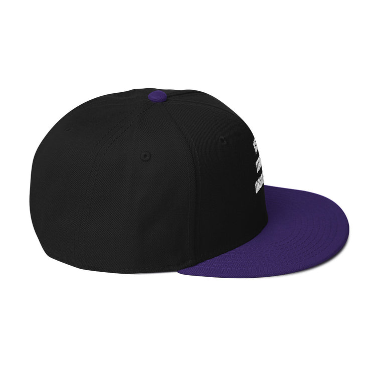 Snapback Hat with a black body and purple flat visor, featuring a high-profile structured design.