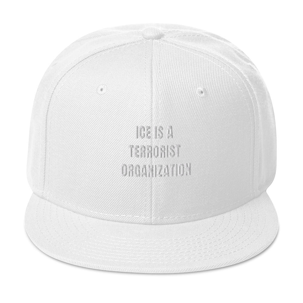 Snapback Hat in navy blue with flat visor and structured design, side view showcasing high-profile style.